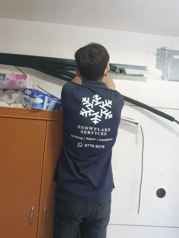 Technician running piping for an installation