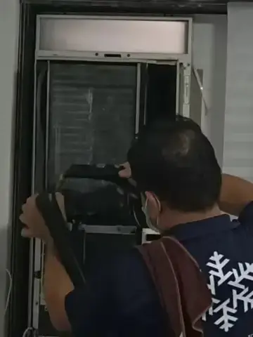 Technician servicing an indoor unit